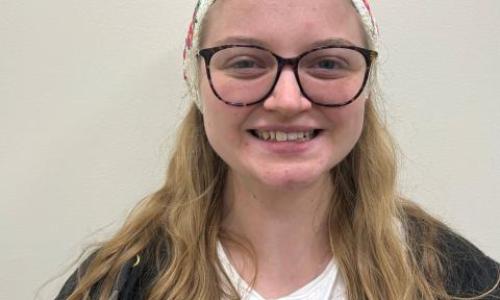 Blonde person smiling