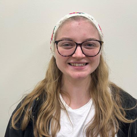 Blonde person smiling